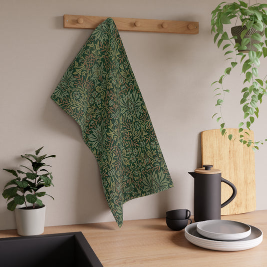A kitchen tea towel with a floral garden pattern inspired by William Morris.