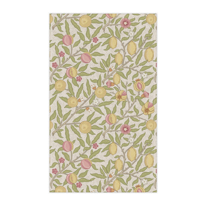 Patterned fabric with lemons, leaves, and flowers on a white background