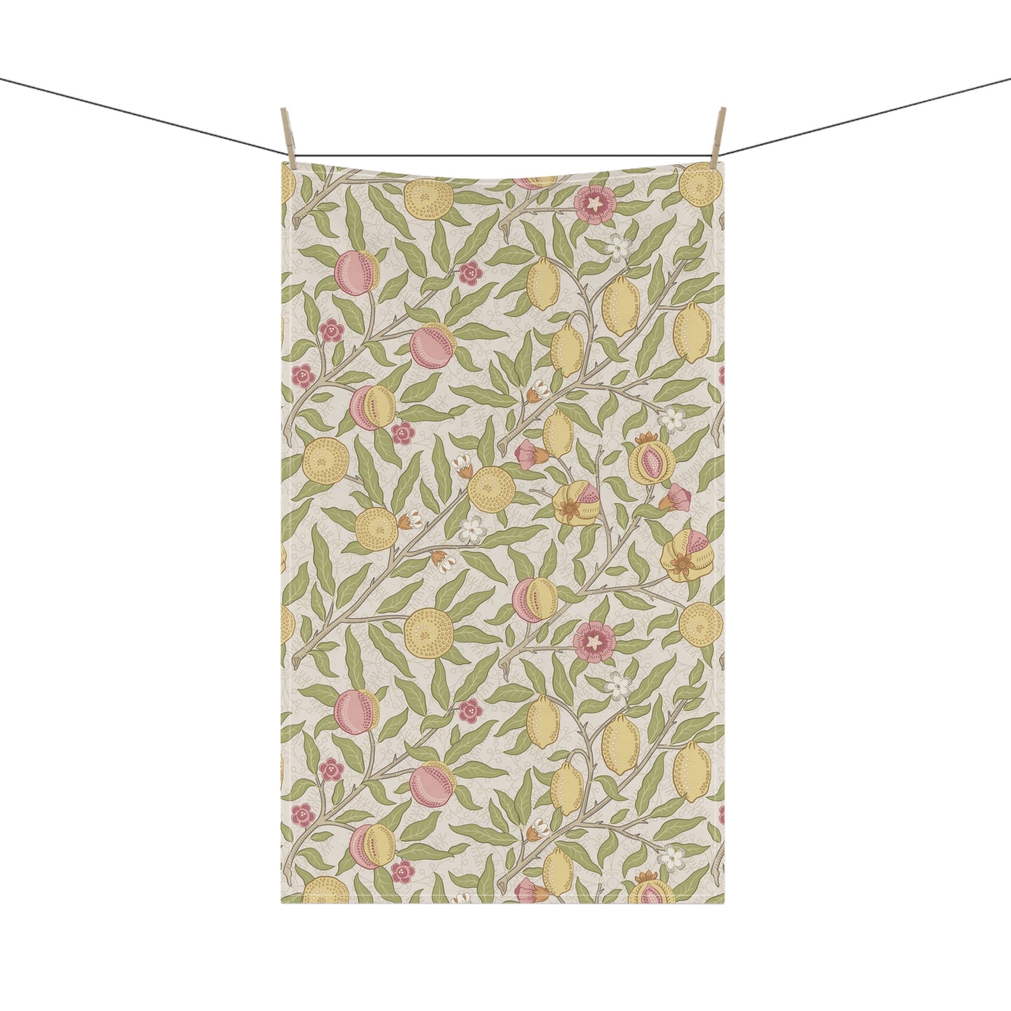 Tea towel with lemon and peach pattern hanging on a line