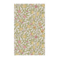 Patterned fabric with lemons, leaves, and flowers on a white background