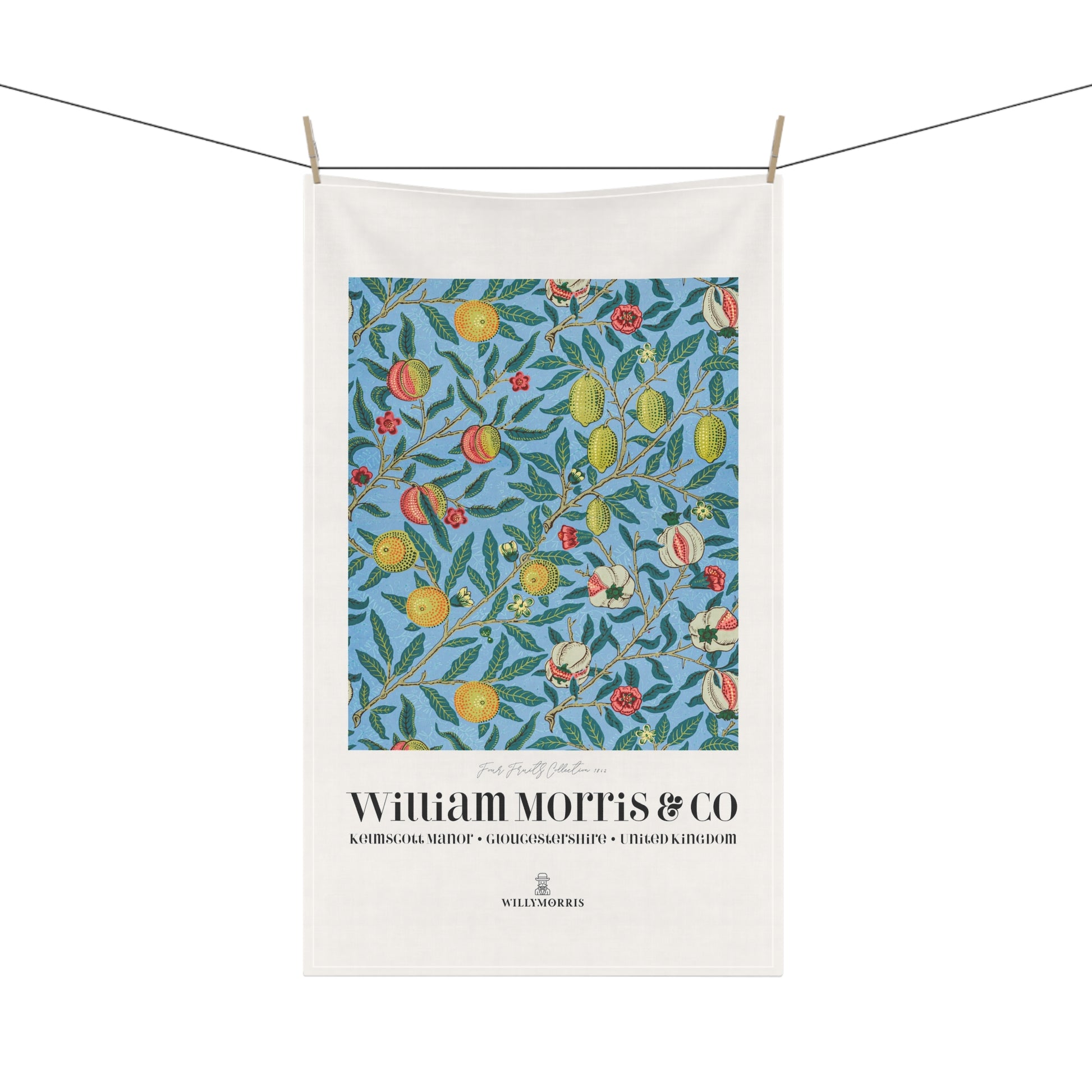 Tea towel with floral design and 'William Morris & Co' branding on a white background
