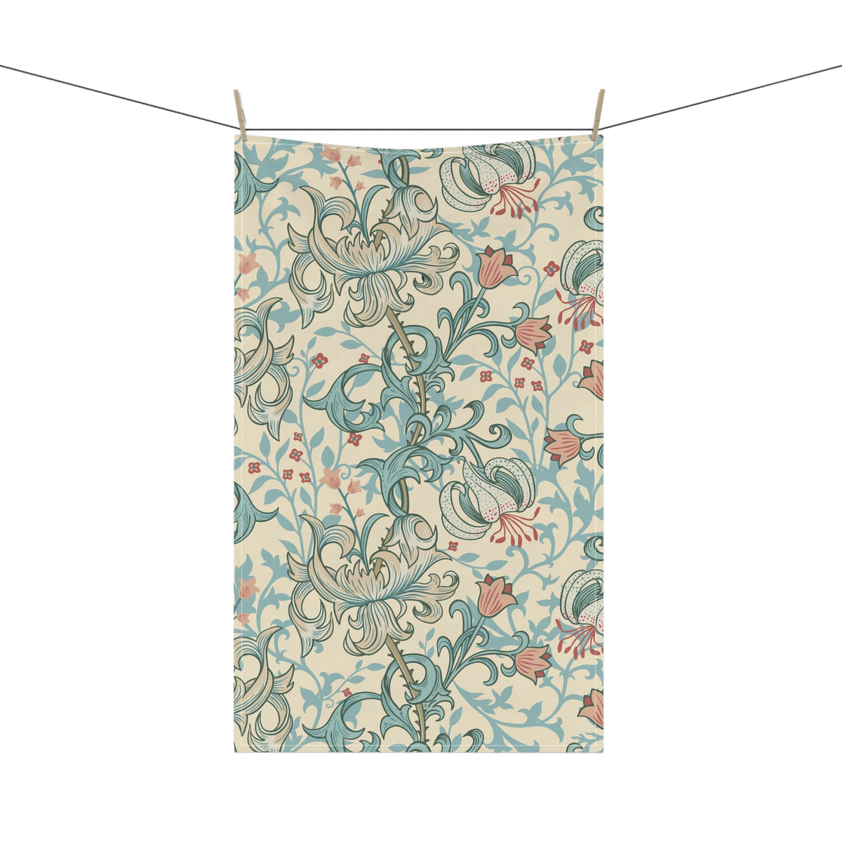 A rectangular fabric tea towel with an ornate floral pattern, suspended by clips from a string against a plain white background.