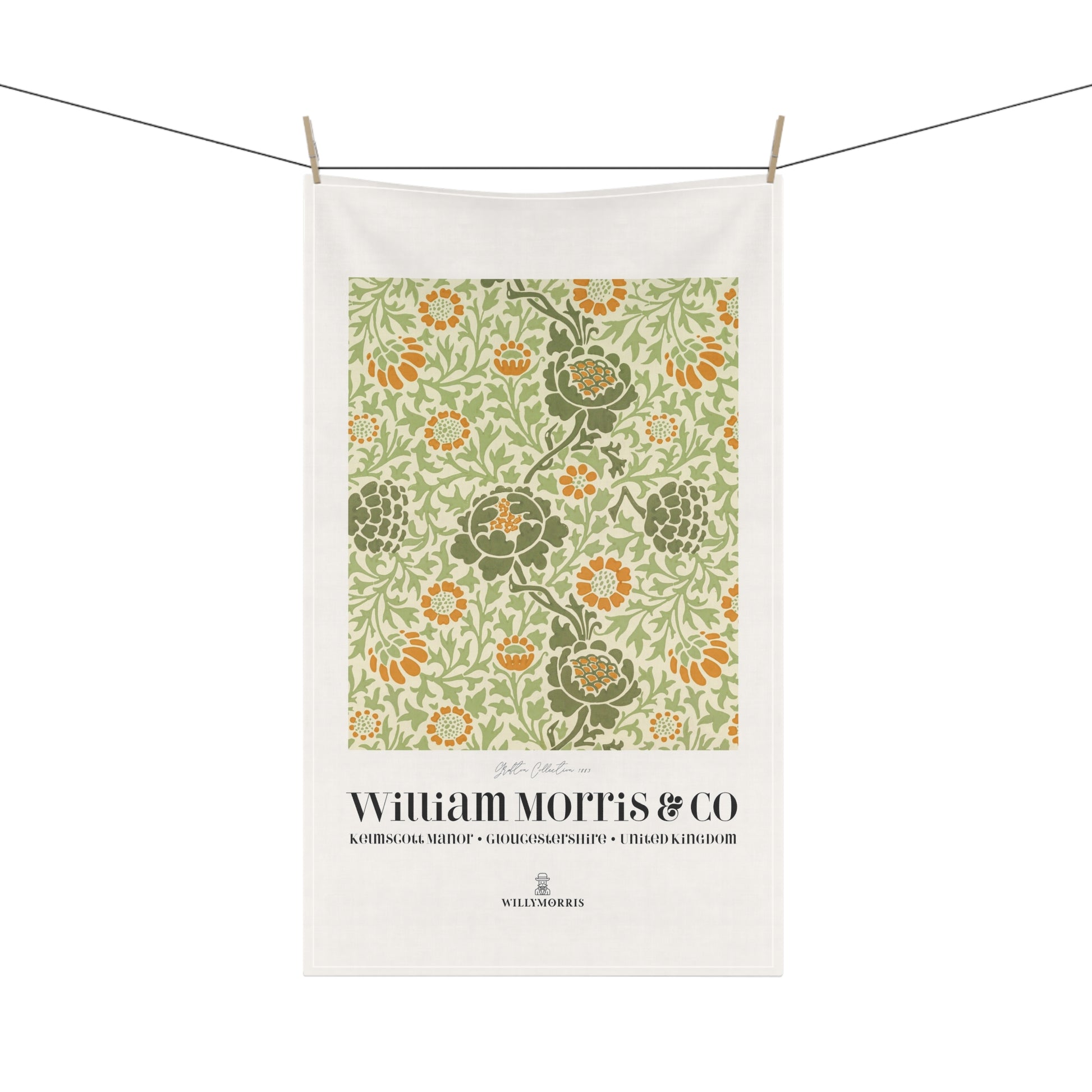 Floral patterned towel with 'William Morris & Co' branding on a white background