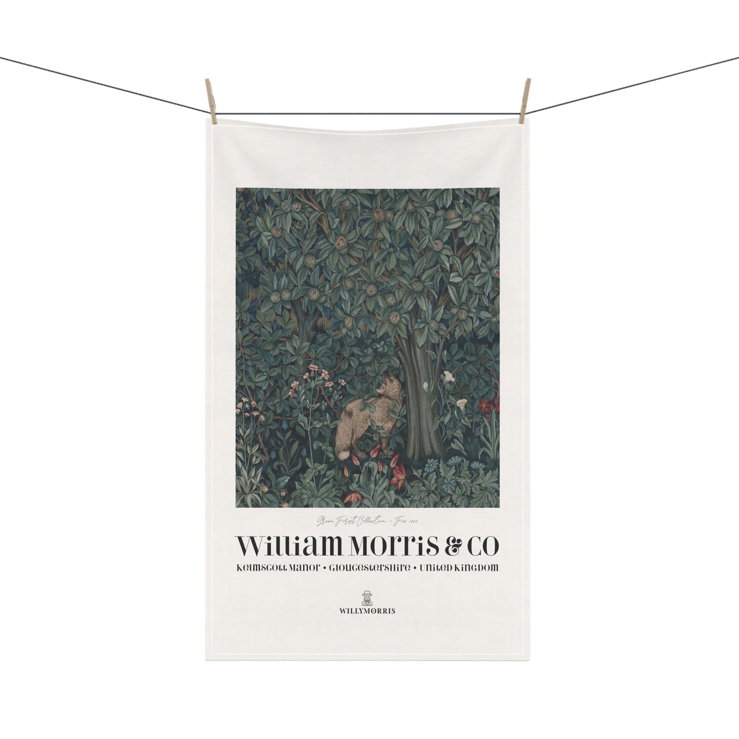 Decorative towel with nature-themed design and 'William Morris & Co' branding on a white background.