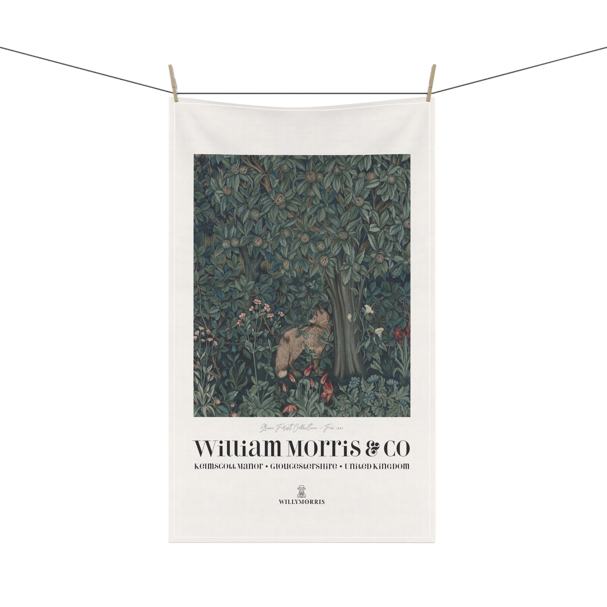 Decorative towel with nature-themed design and 'William Morris & Co' branding on a white background.