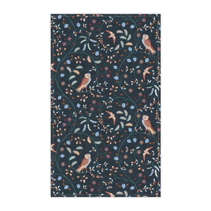 Patterned fabric with birds and flowers on a dark blue background