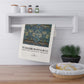 Decorative towel with William Morris & Co design hanging on a shelf in a kitchen setting.