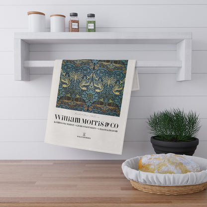 Decorative towel with William Morris & Co design hanging on a shelf in a kitchen setting.
