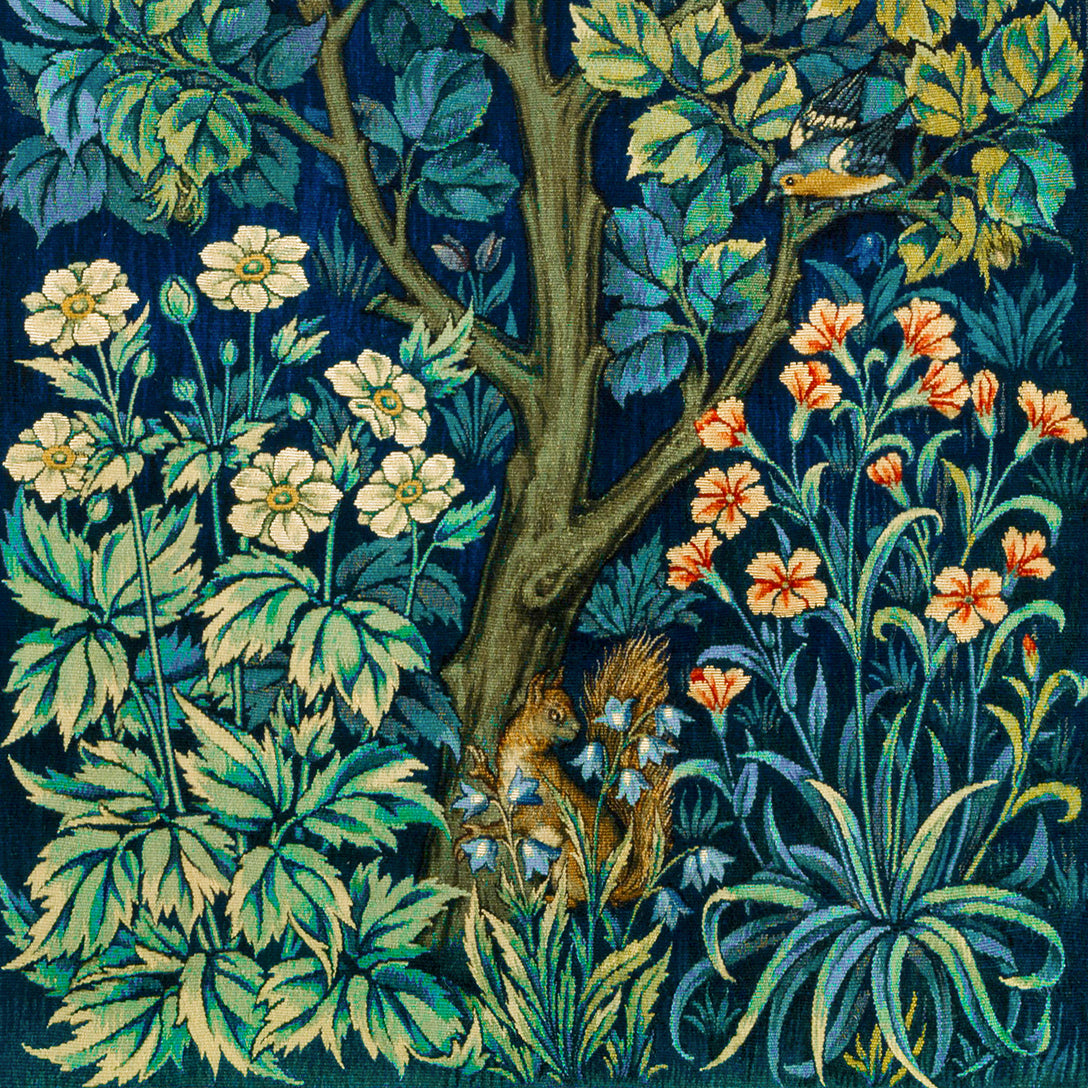 A kitchen tea towel featuring an artistic design with pheasants, squirrels, and floral elements on a blue background.