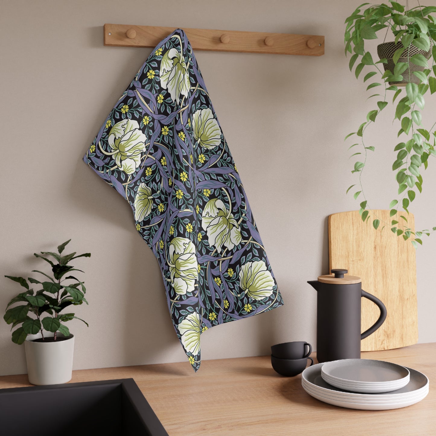 A kitchen tea towel with a floral pattern inspired by William Morris - Pimpernel Collection in lavender colour.