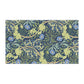 A rectangular kitchen tea towel featuring a floral Arts & Crafts pattern from William Morris & Co with blue flowers and green leaves on a cream background.