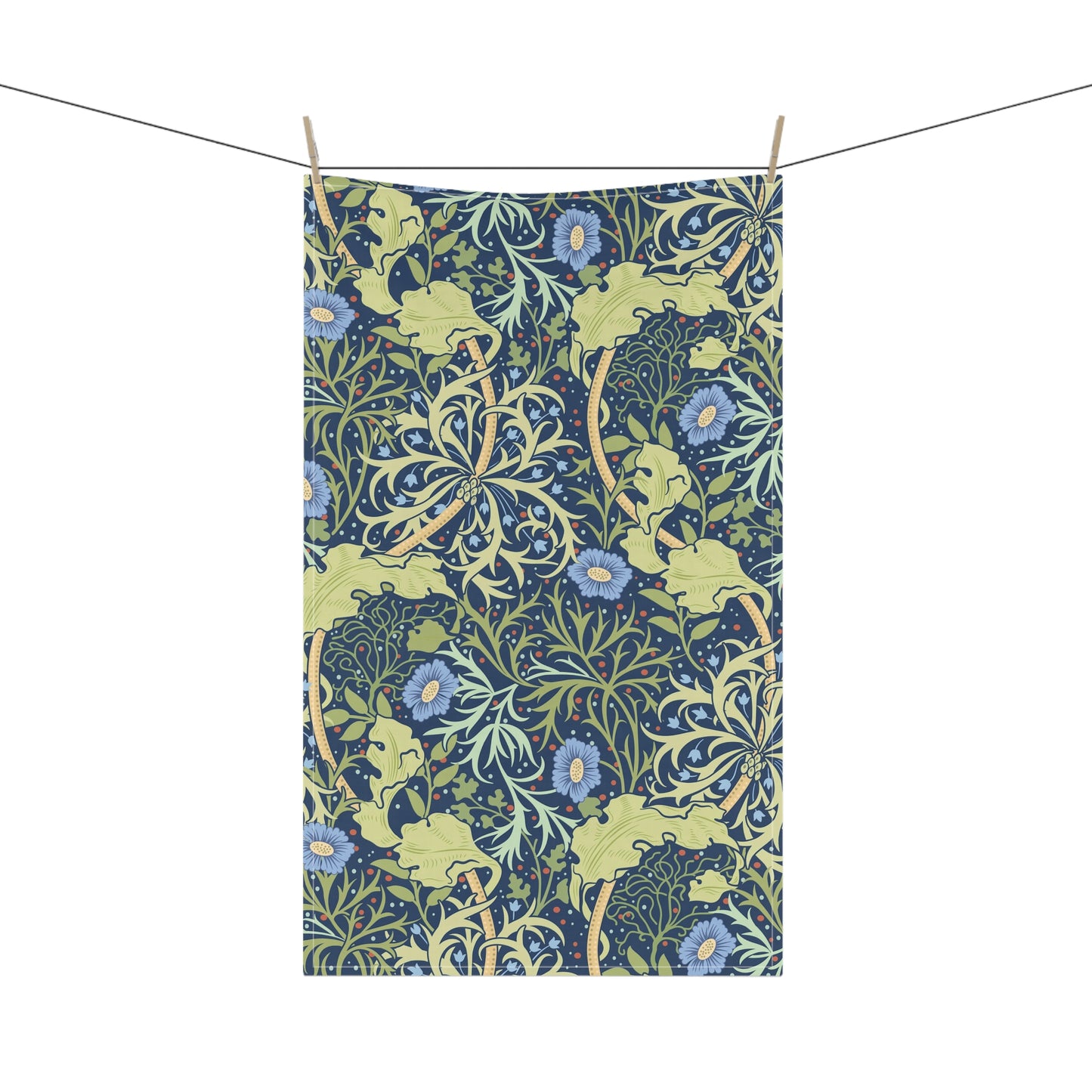 A rectangular kitchen tea towel featuring a floral Arts & Crafts pattern from William Morris & Co with blue flowers and green leaves on a cream background.