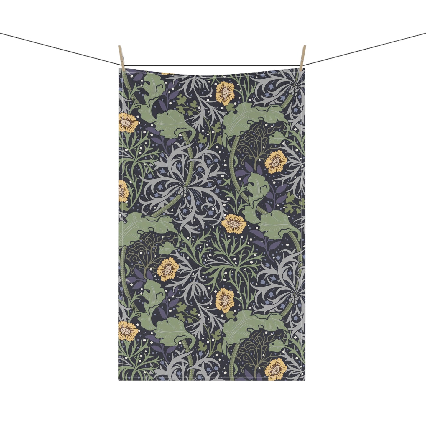 A rectangular kitchen tea towel featuring a repeating pattern of seaweed and yellow flowers on a green background.