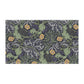 A rectangular kitchen tea towel featuring a repeating pattern of seaweed and yellow flowers on a green background.