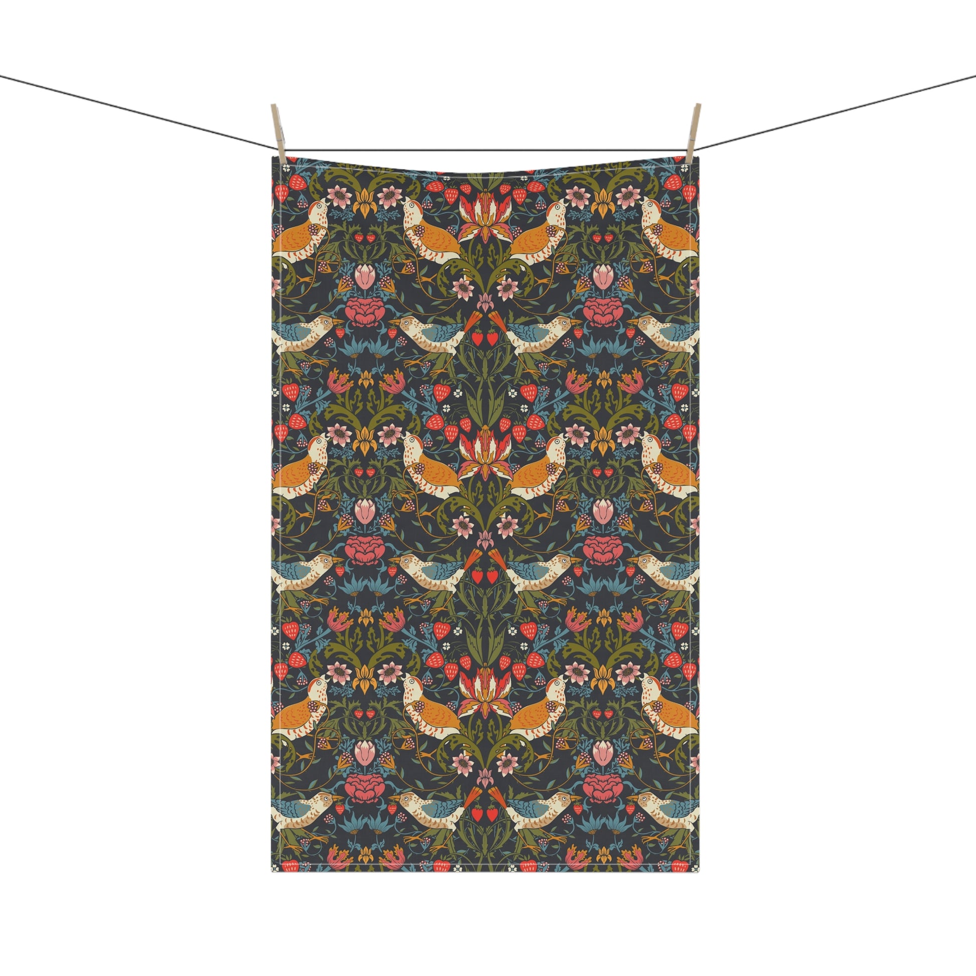 A kitchen tea towel with a repeating pattern featuring birds, flowers, and leaves in dark background, inspired by William Morris' Strawberry Thief design.