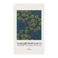 Decorative tea towel with William Morris & Co design on a white background