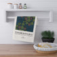 Decorative towel with William Morris & Co design hanging on a shelf in a kitchen setting.