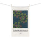 Tea towel with floral design and 'William Morris & Co' branding on a white background