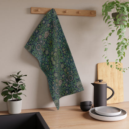 A kitchen tea towel with a green and violet floral pattern inspired by William Morris - Violet and Columbine Collection.