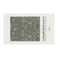 Decorative tea towel with floral pattern and 'William Morris & Co' branding on a white background