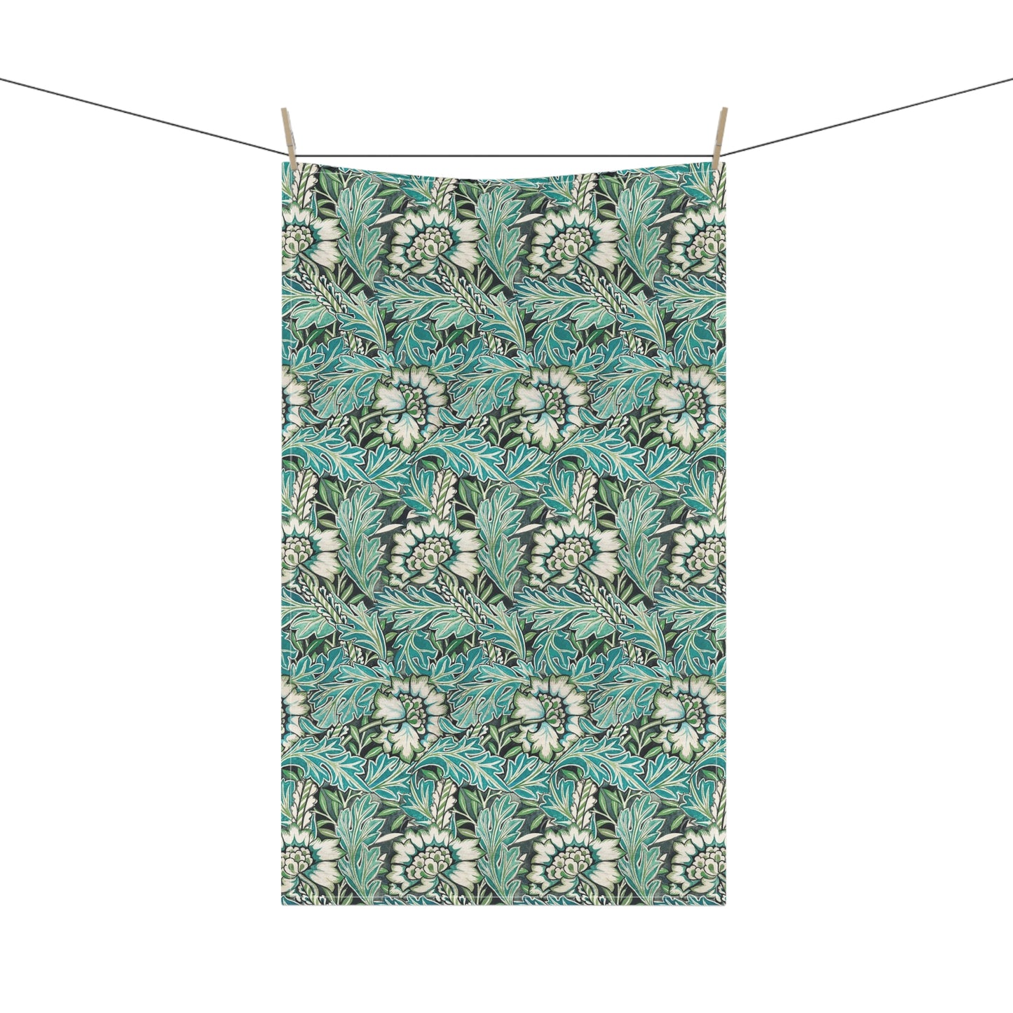 A kitchen tea towel with a floral pattern inspired by William Morris, in shades of blue, green, and white.