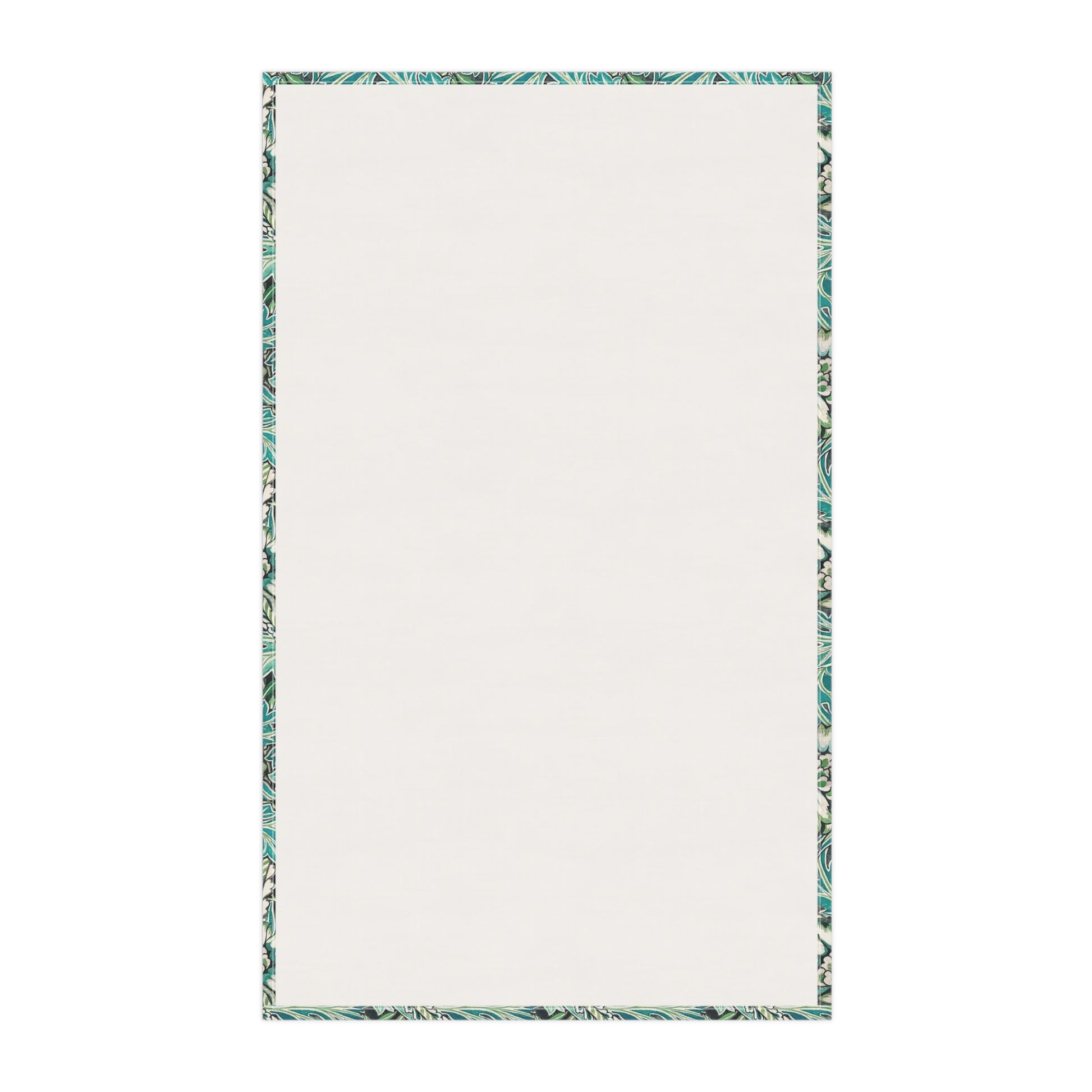 A kitchen tea towel with a floral pattern inspired by William Morris, in shades of blue, green, and white.