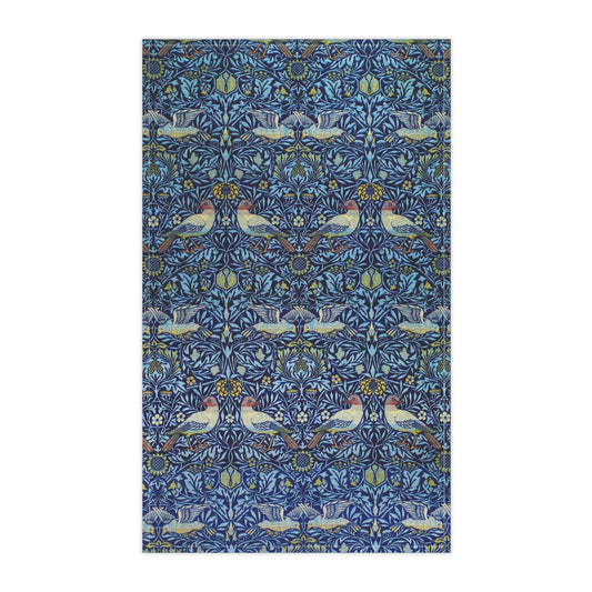 Patterned fabric with birds and floral designs on a blue background