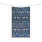 Decorative fabric with a pattern of birds and flowers hanging on a line.