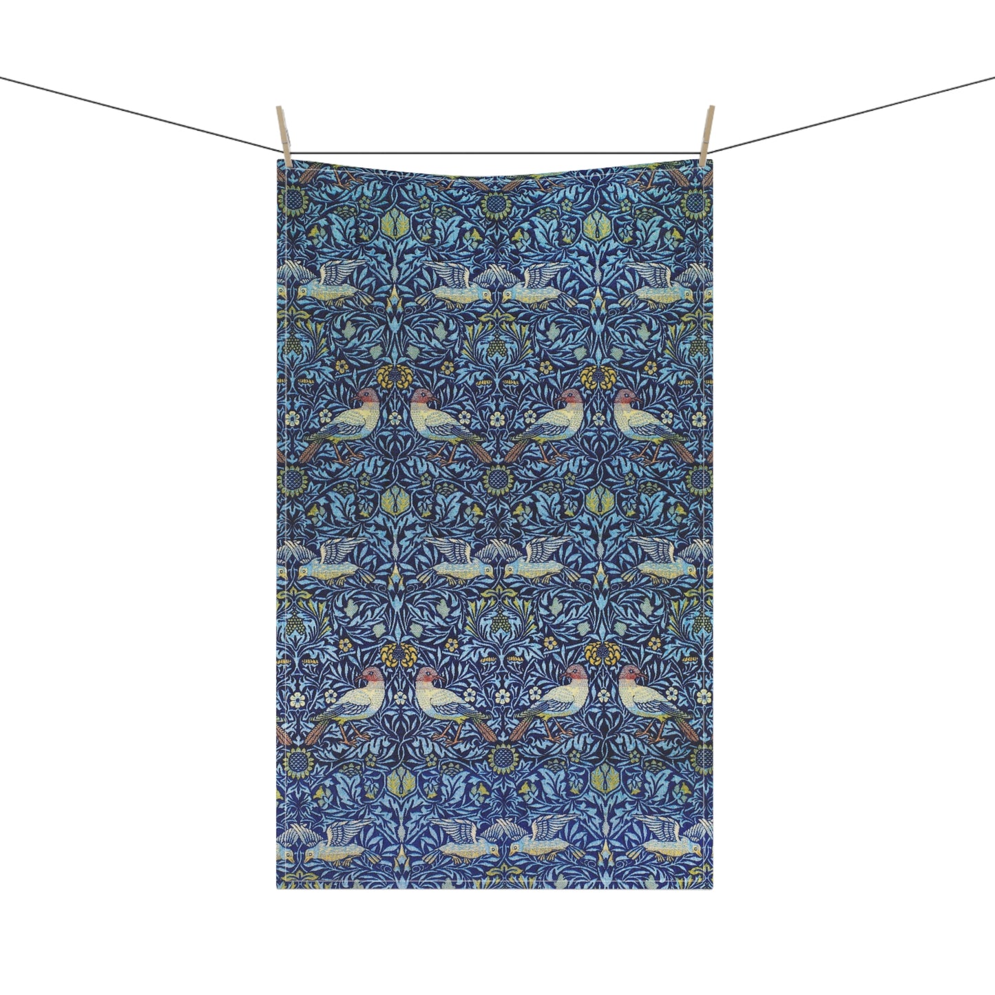 Decorative fabric with a pattern of birds and flowers hanging on a line.