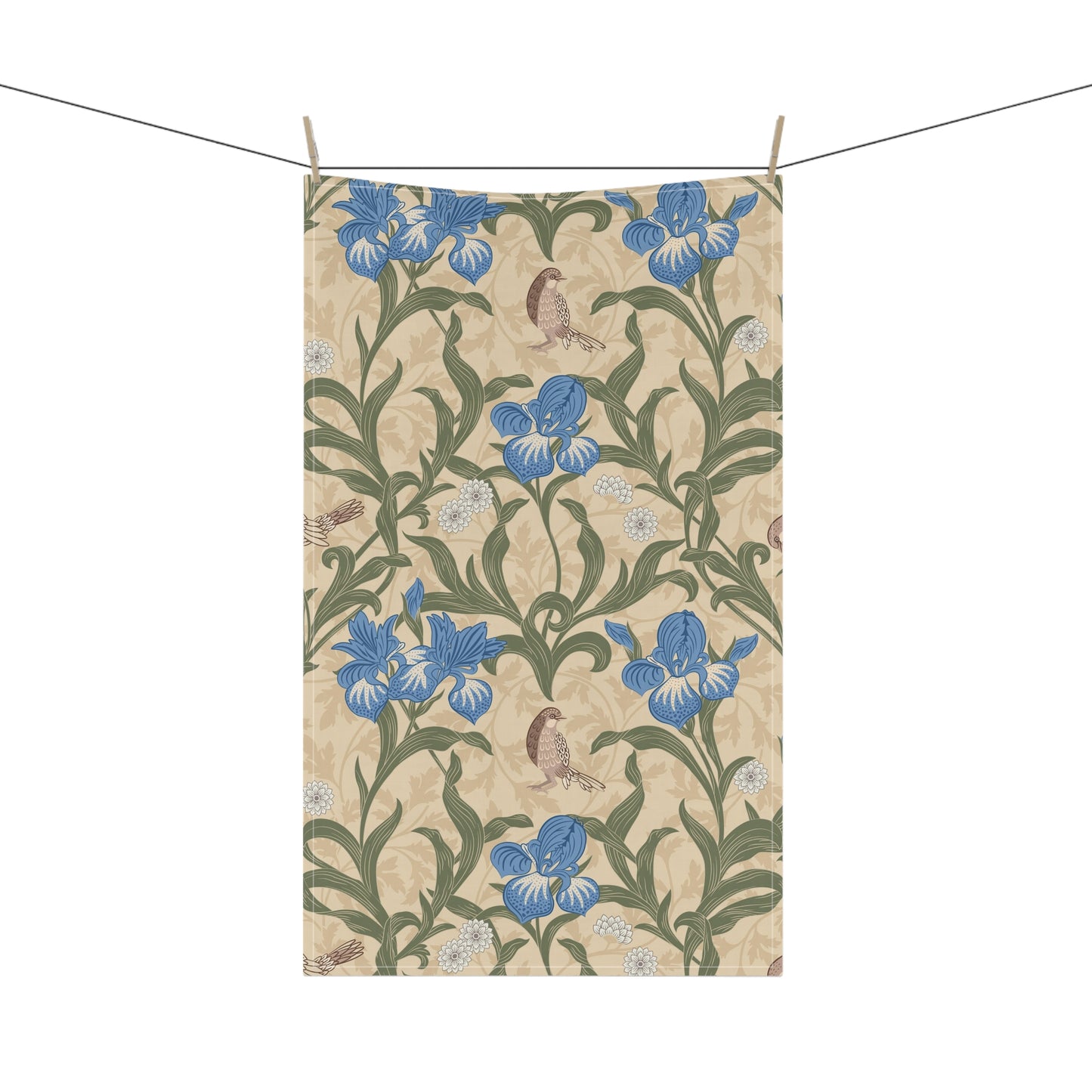 A kitchen tea towel with a William Morris & Co floral pattern featuring blue irises, birds, and a beige background.