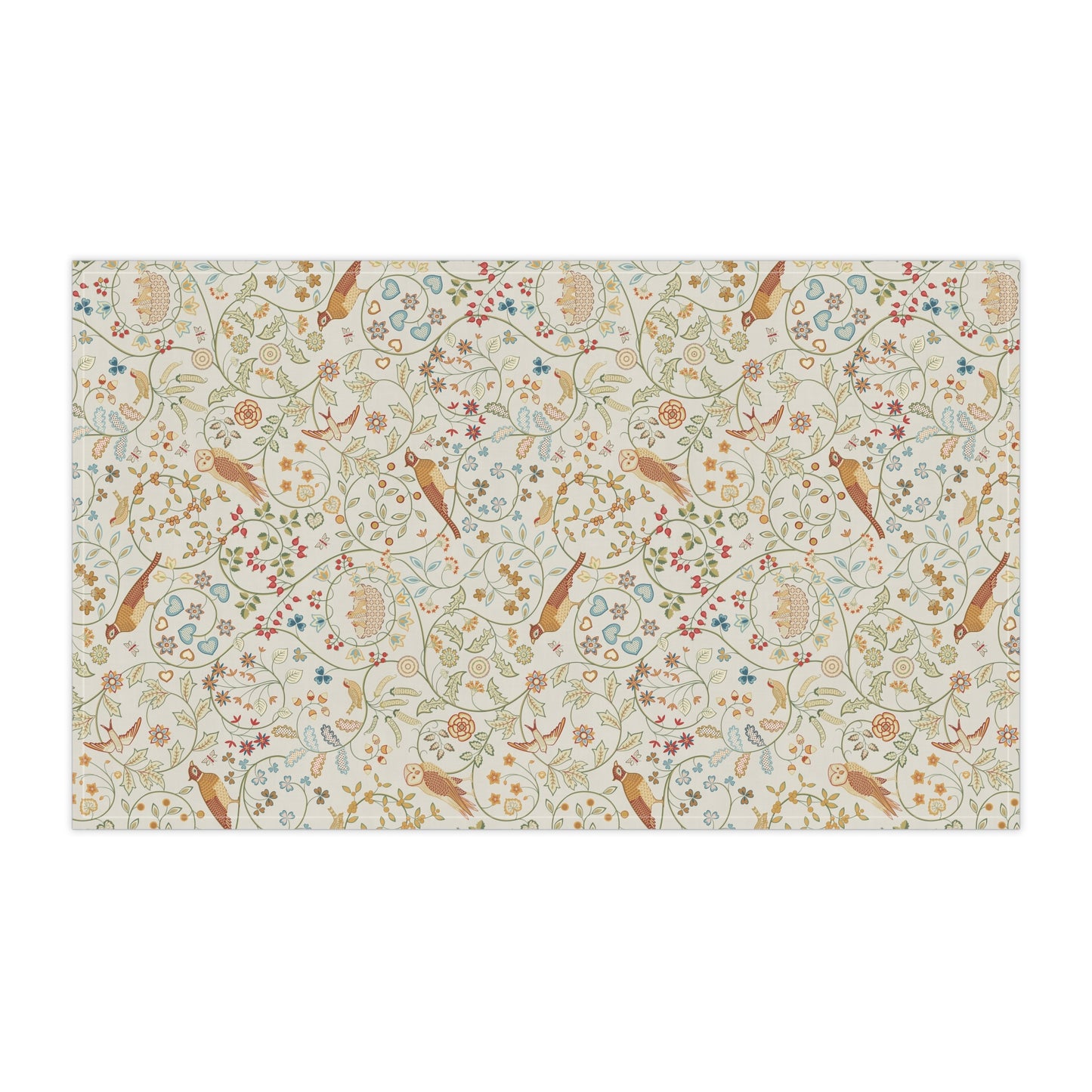 Patterned tea towel with birds and floral designs on a beige background