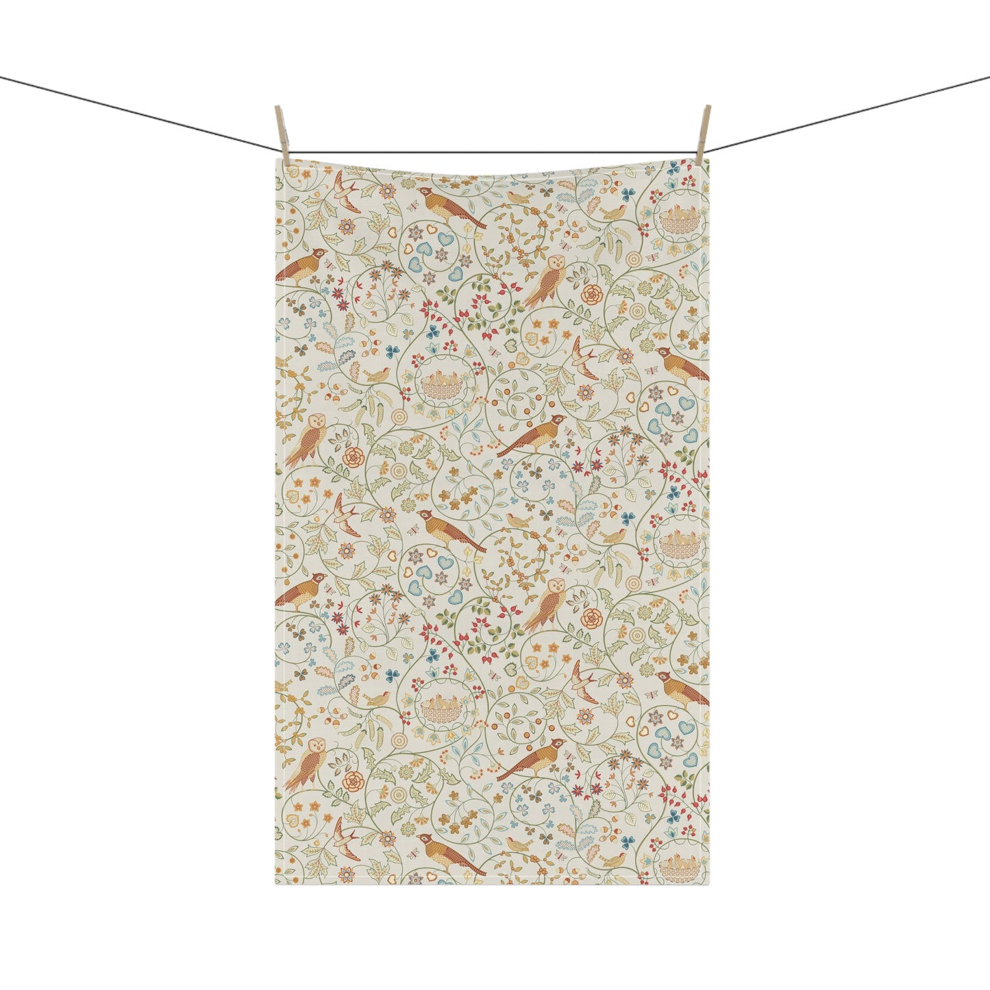 Floral and bird patterned towel hanging on a line