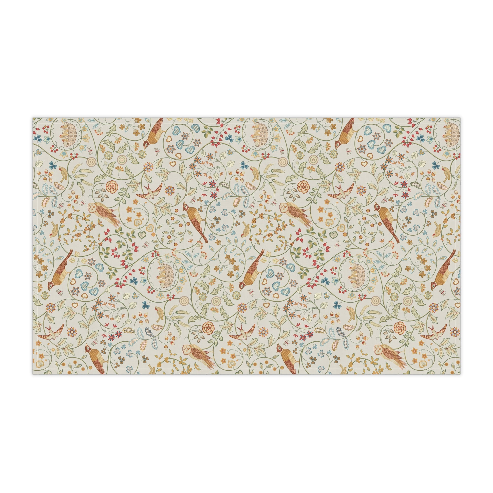 Patterned tea towel with birds and floral designs on a beige background