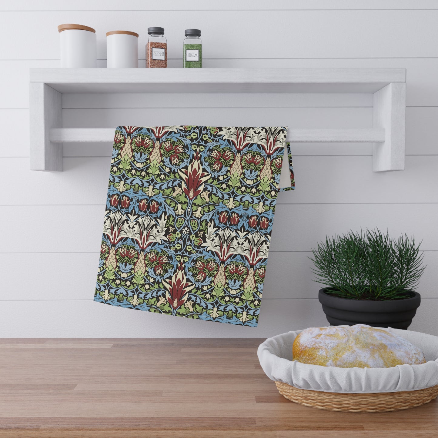 A kitchen tea towel with a floral and geometric pattern inspired by William Morris - Snakeshead Collection.