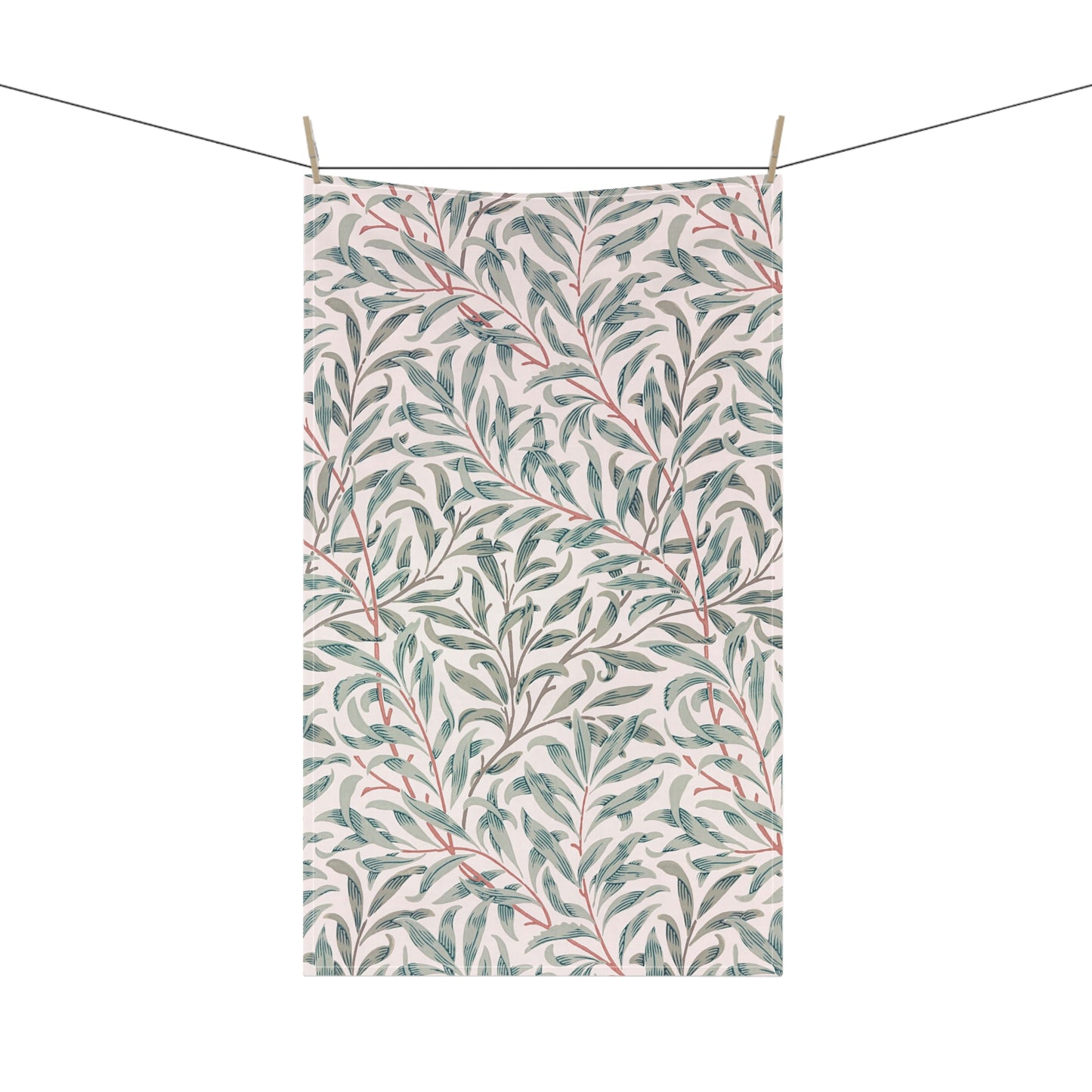 Towel with leaf pattern hanging on a line
