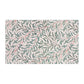 Patterned tea towel with leaf design on a white background