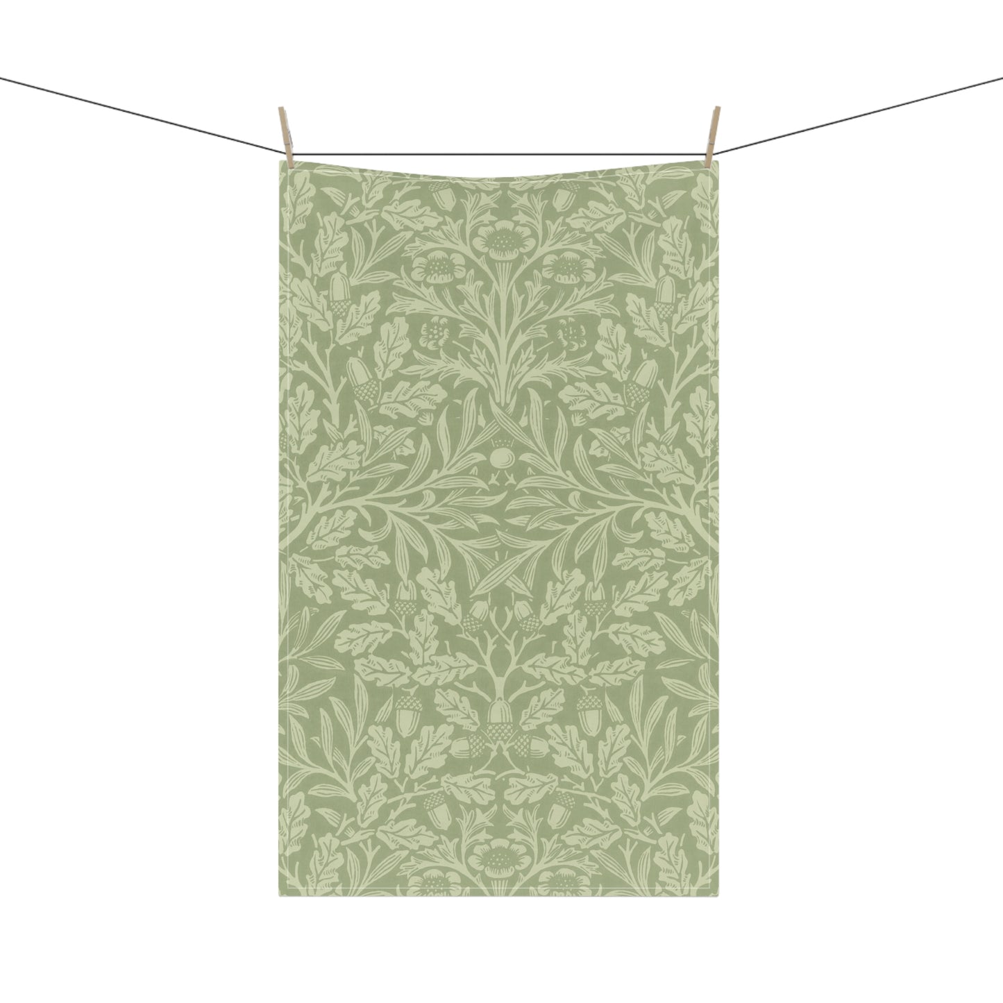 A green kitchen tea towel with a floral and leaf pattern inspired by William Morris & Co - Acorn and Oak Leaves Collection.
