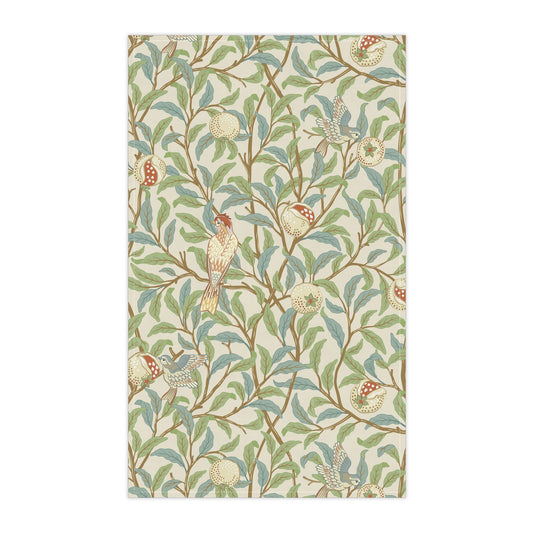 A kitchen tea towel with a floral and bird design, inspired by the William Morris - Bird and Pomegranate Collection in a parchment color.