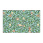 A kitchen tea towel with a blue background featuring bird and pomegranate patterns inspired by William Morris.