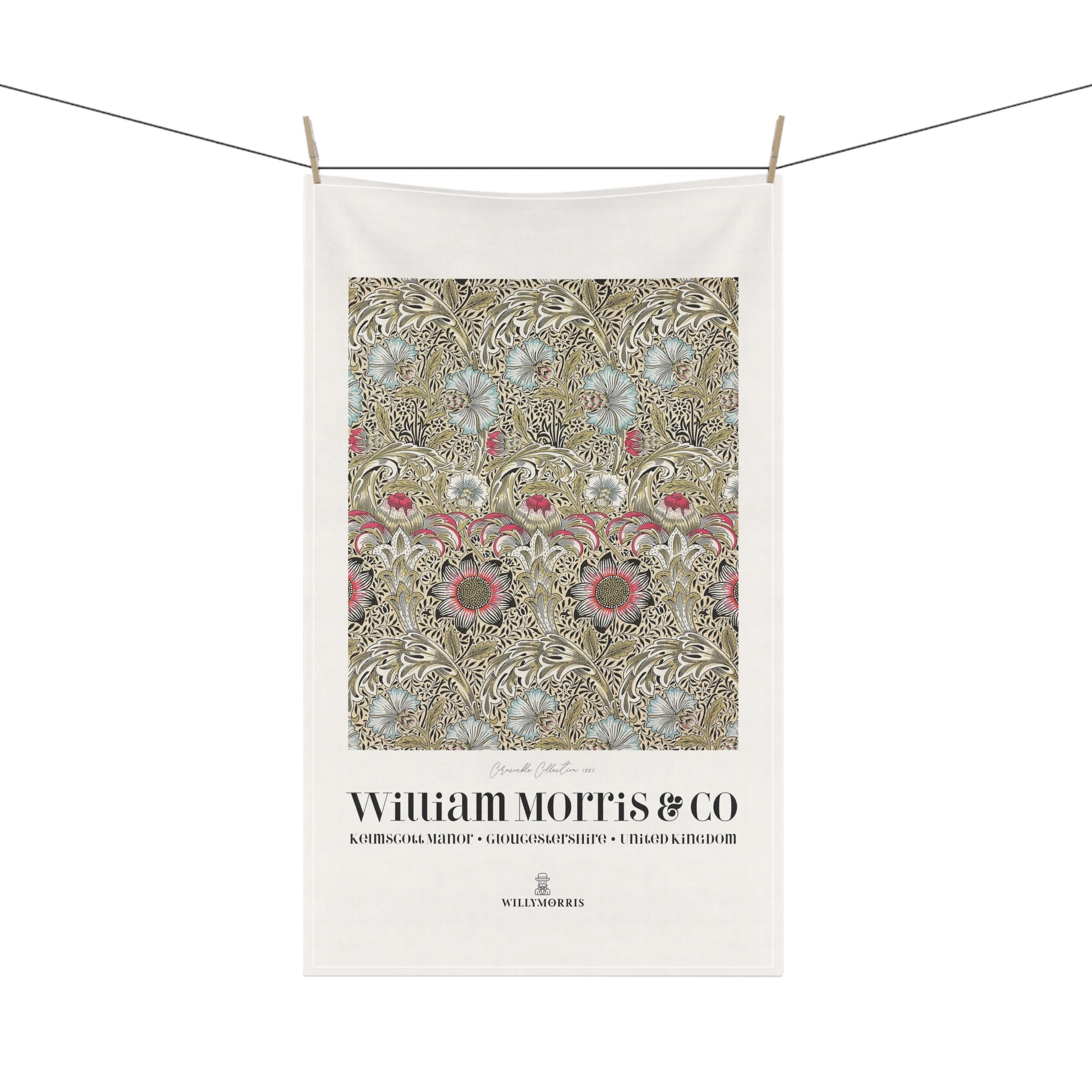 Decorative towel with floral pattern and 'William Morris & Co' branding on a white background