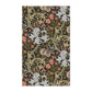 A rectangular tea towel featuring a dense, vintage-style botanical pattern with large pale blue-gray lilies, coral-pink flowers, green leaves, and small bird motifs on a very dark charcoal background.