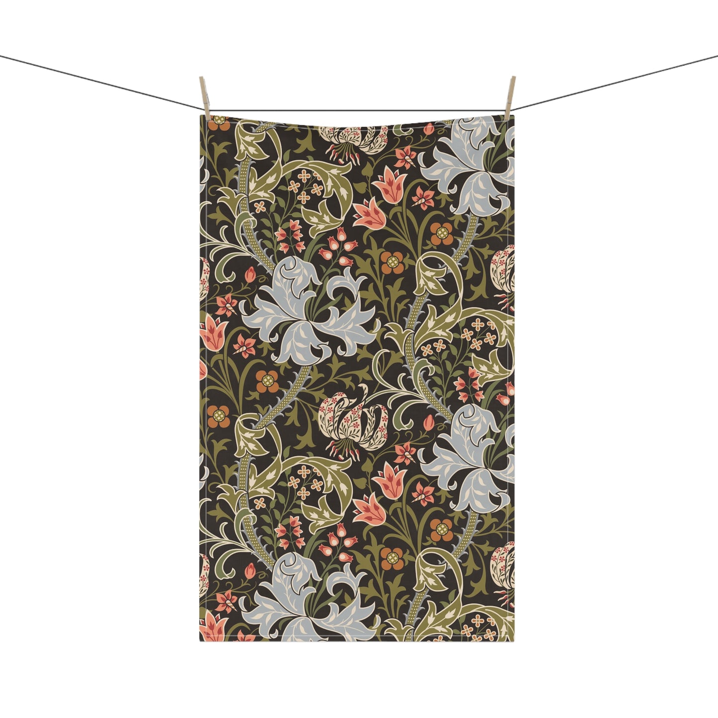 A rectangular tea towel with a dense botanical and floral pattern hangs from two clips on a string against a plain white background.