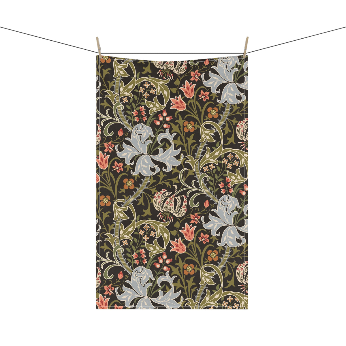 A rectangular tea towel with a dense botanical and floral pattern hangs from two clips on a string against a plain white background.