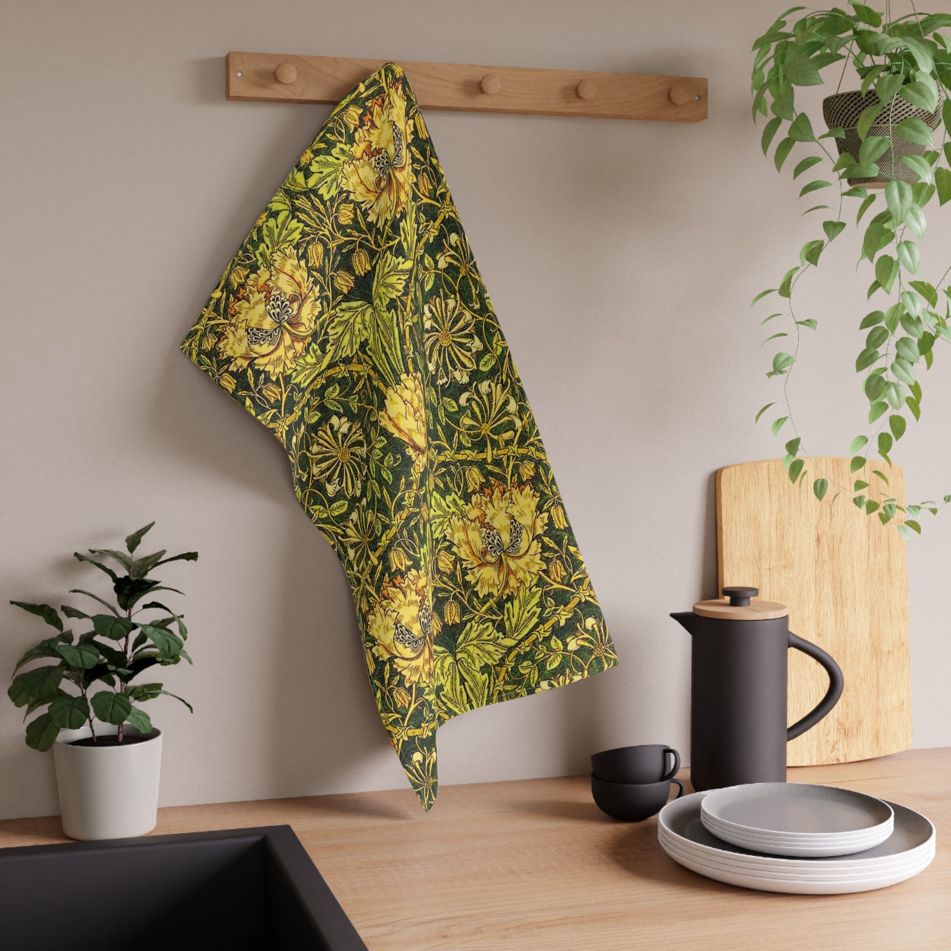 Decorative floral William Morris & Co pattern with yellow flowers and green leaves on a dark background