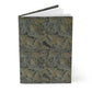 Notebook with a decorative leaf pattern on a white background