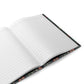 Open notebook with floral design on the cover on a white background