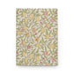 Notebook with floral and fruit pattern on a white background