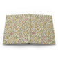 Floral patterned notebook with lemons and leaves on a white background