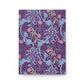 Notebook with a colourful William Morris & Co floral and dragon design on a white background