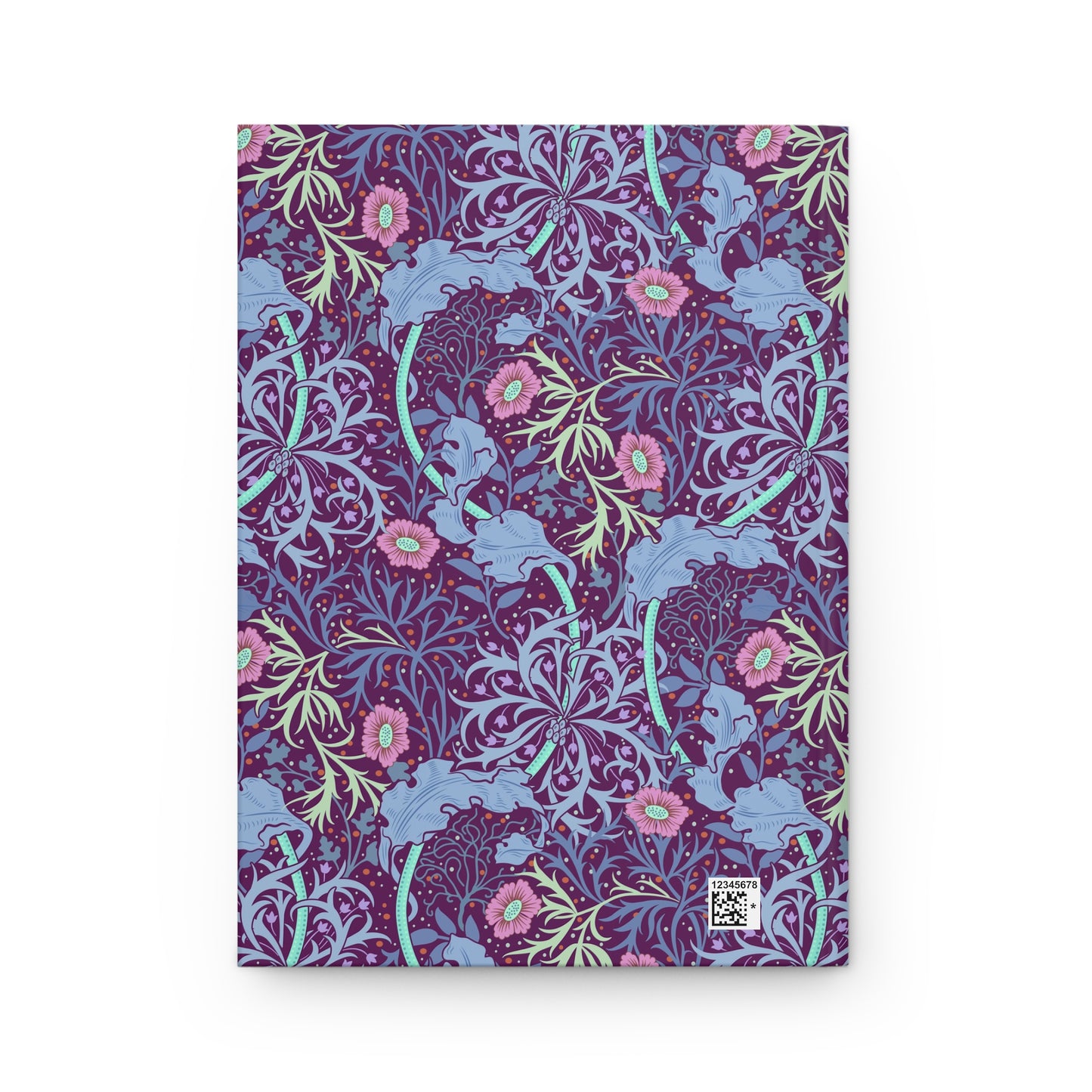 Notebook with a William Morris & Co floral and elephant pattern on a white background
